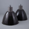 Extra large pendant light with a steel black enamelled dome shaped shade with white interior on a grey background