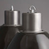 Close-up of industrial metal fixtures on a gray background