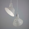 A vintage thorlux grey vitreous enamel ceiling light with an angled shade for directional light