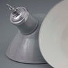 A vintage thorlux grey vitreous enamel ceiling light with an angled shade for directional light