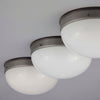 A round flush mount vintage opaline and bakelite ceiling light at 270mm diameter