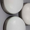 A round flush mount vintage opaline and bakelite wall light at 270mm diameter