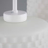 Close-up of a white lamp base on a gray background