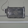manufacturers plate on the vintage strip light by REVO