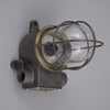 an iron and brass industrial cage wall light restored for modern use