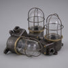 an iron and brass industrial cage wall light restored for modern use