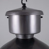 Metallic pendant light fixture on a gray background
