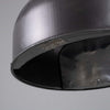 Mesko manufacturers plate on the side of a graphite grey steel industrial pendant light