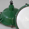 Heavy steel industrial pendant lights by REVO finished with vitreous green enamel