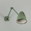 An original 1950s Anglepoise-style green machinist wall light