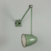 An original 1950s Anglepoise-style green machinist wall light