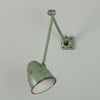 An original 1950s Anglepoise-style green machinist wall light