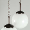 a 250mm vintage milk glass globe pendant light with black bakelite hanging gallery.