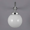 A 1950s milk glass globe wall light with polished aluminium swan neck wall mount.