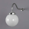A 1950s milk glass globe wall light with polished aluminium swan neck wall mount.