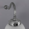 A 1950s milk glass globe wall light with polished aluminium swan neck wall mount.