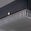 A retro square glass pendant light. 260mm square prismatic glass shades with a black metal housing ceiling mounted on a white rod.