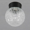 a small vintage moulded decorative glass globe light with black bakelite gallery