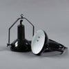 Black vitreous enamel vintage industrial pendant light with adjustable arm to tilt the illumination.