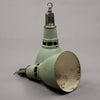 Vintage Thorlux green enamel pendant light on a plain background