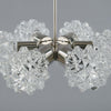 Close up of the crystal cut spikey glass globes that form part of a retro chandelier