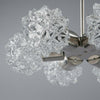 Close up of the crystal cut spikey glass globes that form part of a retro chandelier