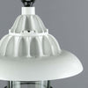 Close up of the white fins at the top of an industrial cage pendant light