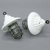 a white vintage industrial ceiling light with black cage which covered the glass dome over the lampholder.