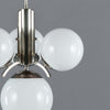 1920s Art Deco Opaline Globe Chandelier featuring 4 milk glass globes on a pewter ballust mounted to the ceiling