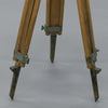 footings of a vintage wooden tripod