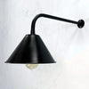 The wall mounted industrial style black downlight is a new fixture based on the design of the British Army festoon shades that were used in the field. Made in England by Loomlight, the conical steel lamp shade is painted satin black and is extended from the wall by a curved black wall arm fixture. Ideal for illuminating pictures on the wall or down lighting walls for ambiance. This wall fixture can be used on its own or alongside ceiling lights.