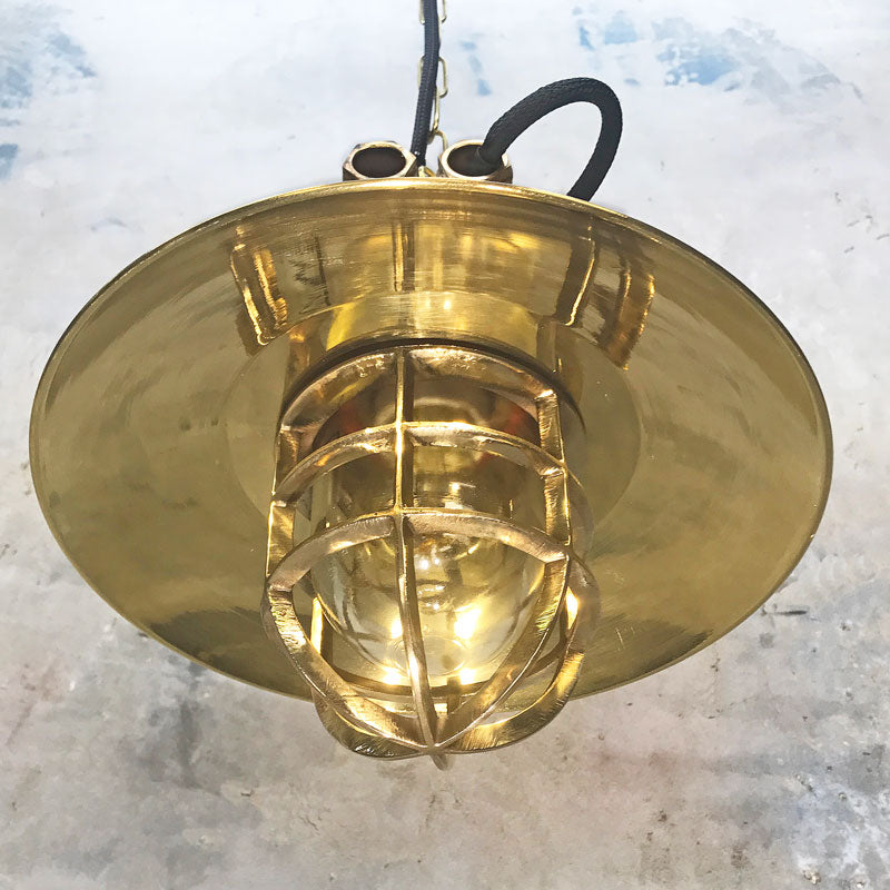 Brass explosion proof cage light for ceiling. A vintage industrial style original ceiling light restored ready to use