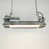 The vintage T8 LED striplight is a reclaimed industrial fixture refurbished for modern interiors.