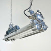 The vintage T8 LED striplight is a reclaimed industrial fixture refurbished for modern interiors.
