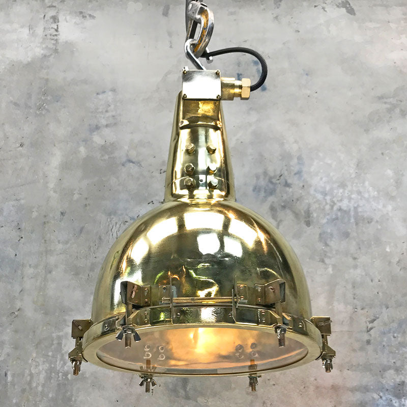 A large brass marine searchlight ceiling light. Originally a brass marine searchlight converted into a ceiling light by Loomlight