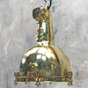 A large brass marine searchlight ceiling light. Originally a brass marine searchlight converted into a ceiling light by Loomlight