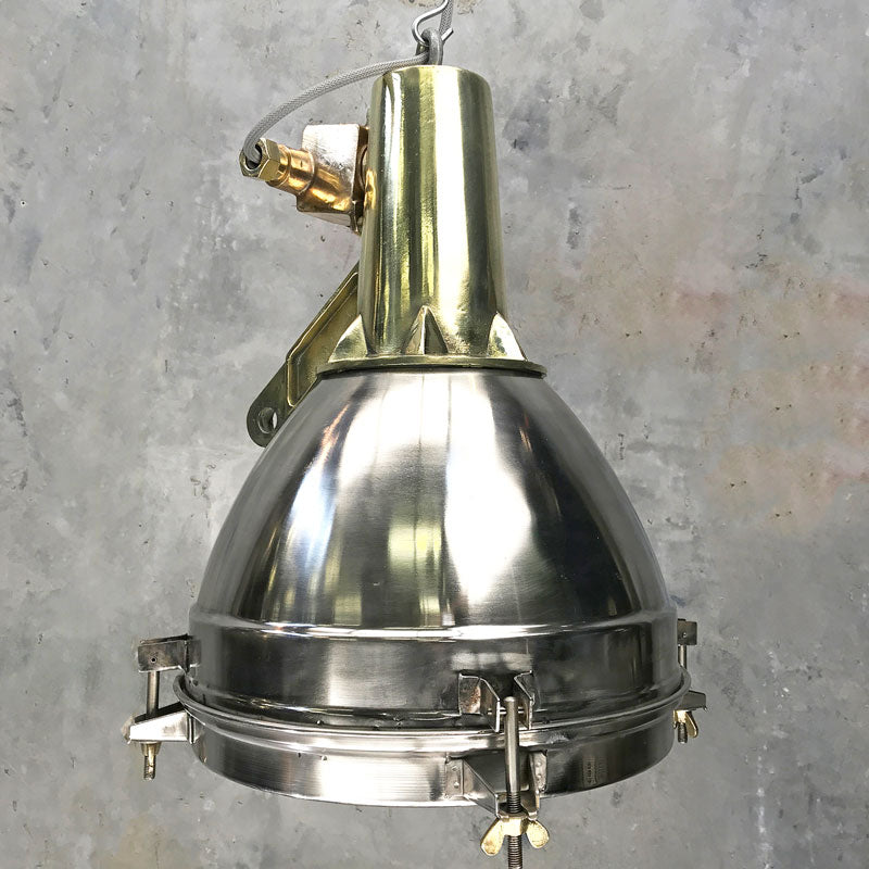 Large Stainless Steel Pendant Light with a brass top section. It has been reclaimed from decommissioned cargo ships. Loomlight professionally restore these fixtures and rewire with E27 lamp holders compatible with LED light bulbs. 