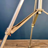Bespoke steampunk floor lamp reclaimed and restored with an aluminium lamp head fitted to an extendable tripod by Linhof