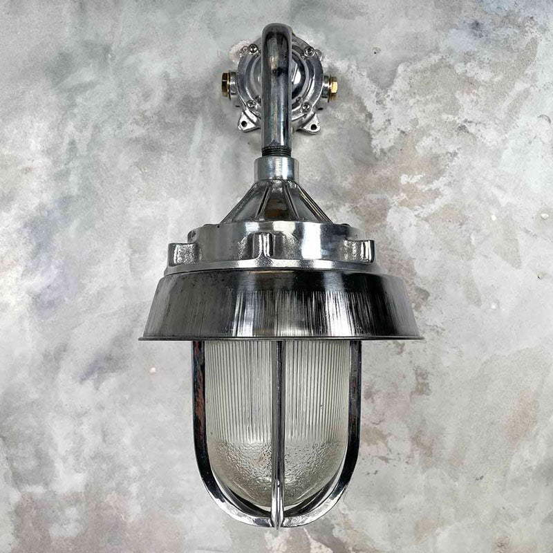 A large outdoor wall light in aluminium and a prismatic glass dome. Perfect for a grand entrance or front door. This vintage outdoor lighting has been restored for modern use