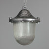 Vintage industrial Aluminium pendant light with prismatic glass shade on a gray background