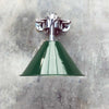 Introducing our industrial style wall downlight, a testament to functional design and military-inspired aesthetics. Featuring a deep green lamp shade based on the design of the British military green festoon shades that we once reclaimed. Mounted on a bespoke galvanised steel cantilever fixture, this versatile lighting solution combines military charm with contemporary practicality.