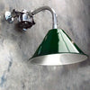 Introducing our industrial style wall downlight, a testament to functional design and military-inspired aesthetics. Featuring a deep green lamp shade based on the design of the British military green festoon shades that we once reclaimed. Mounted on a bespoke galvanised steel cantilever fixture, this versatile lighting solution combines military charm with contemporary practicality.