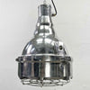 The large explosion proof cast aluminium pendant light was made by the Indian company Baliga Lighting Equipments Ltd. It is a very heavy solid metal light fixture which features a cage over the tempered glass lens that protects the lamp holder from external elements. 