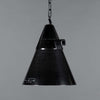 A reclaimed industrial black bakelite pendant light