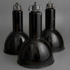 1930's Black enamel pendant light on a gray background relcaimed from a factory and restored