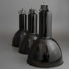 1930's Black enamel pendant light on a gray background relcaimed from a factory and restored