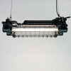 A vintage industrial black caged ceiling light. Solid aluminium retro tube light painted black ideal for lighting modern homes or commercial interiors