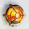 Reclaimed and restored vintage industrial brass bullseye bulkhead wall light. Featuring a bullseye style cage to protect the lamp holder.