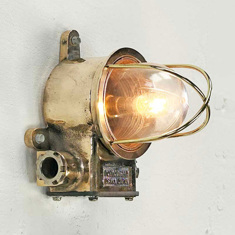Shop our vintage industrial wall sconce. The Kokosha brass wall light is the epitome of industrial design. This vintage industrial light fixture is refurbished in-house and compatible with LED light bulbs. Ideal for modern interiors looking to inject vintage industrial edge.