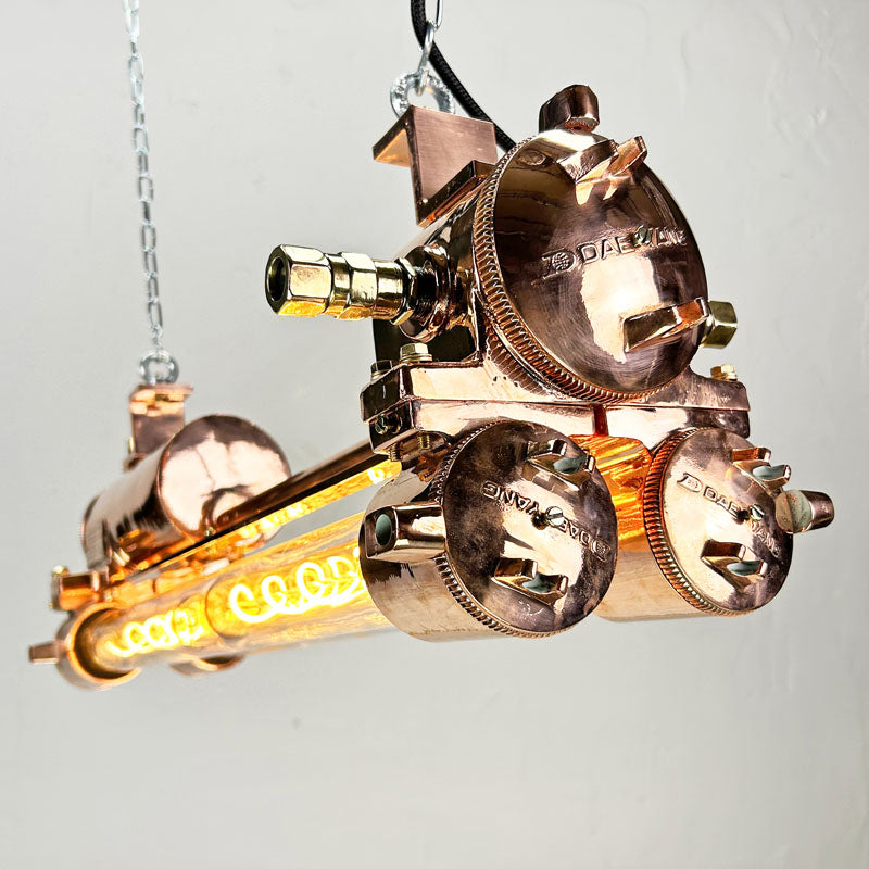 The copper edison strip light is a vintage industrial feature light with a modern finish. It has a highly polished copper finish. Fitted with dimmable LED Edison tubes and supplied with hanging chain and ceiling hooks.